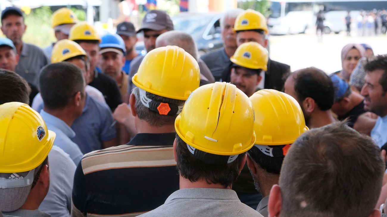 Site crew gathered in hard hats for a safety briefing